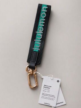 Lululemon Never Lost Keychain NWT green Teal Gold Clip Wristlet Strap Bag Charm